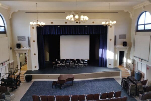 view of auditorium stage, piano and seating from 2nd level
